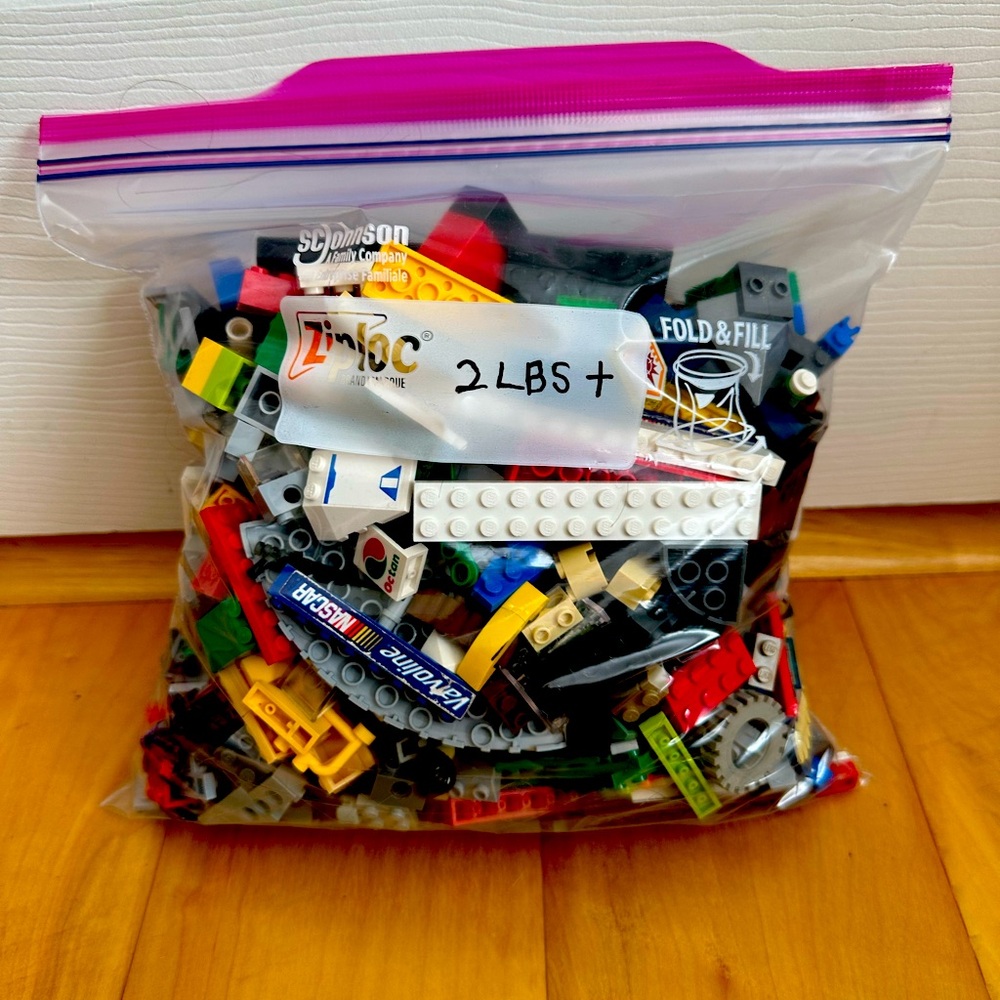 Lego pieces 2lbs + in a gallon size bag.